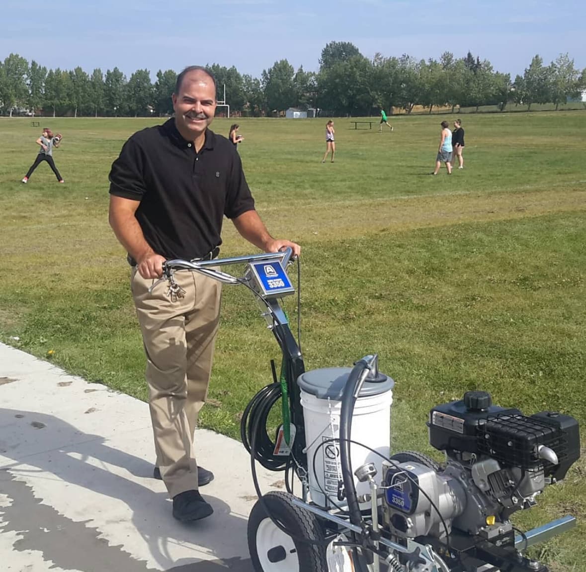 Paint contractor holding a spray gun at Sprayer Rescue